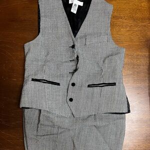 Valerie Steven’s Black and White Vest and Skirt